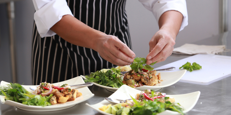 commercial kitchen supply chef working on plates