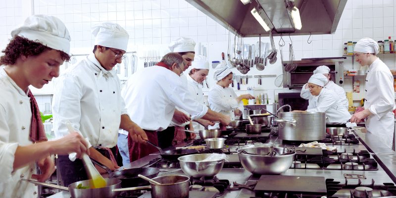 restaurant supply store. A group of Chefs in a kitchen